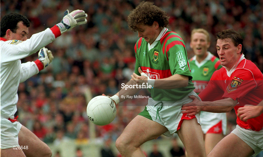 15 August 1993; Anthony Finnerty of Mayo in action against Cork goalkeeper John Kearns and Stephen O'Brien of Cork during the All Ireland Senior Football Semi-Final match between Cork and Mayo at Croke Park in Dublin. Photo by Ray McManus/Sportsfile