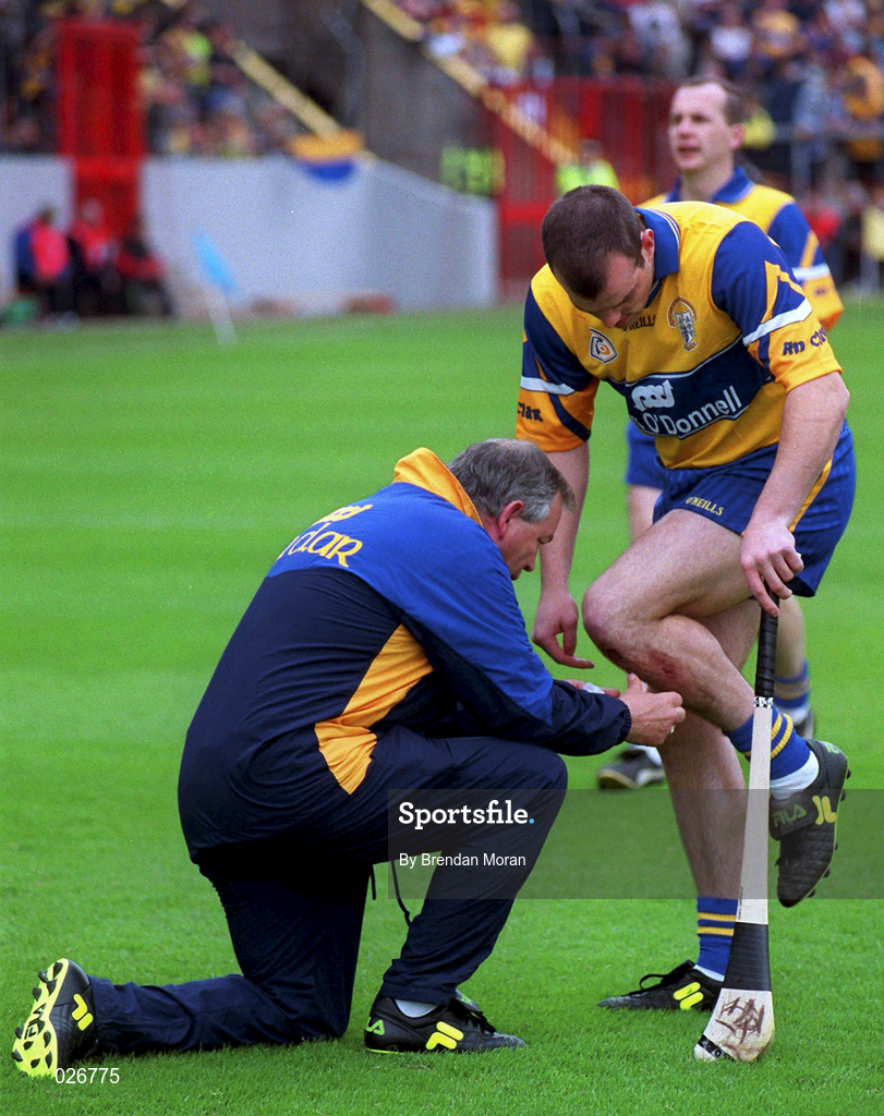 12 June 1999; Clare Physio Colm Flynn attends to Ollie Baker during the Munster Senior Hurling Championship Semi final Replay match between Clare v Tipperary at Páirc Uí Chaoimh in Cork. Photo by Brendan Moran/Sportsfile
