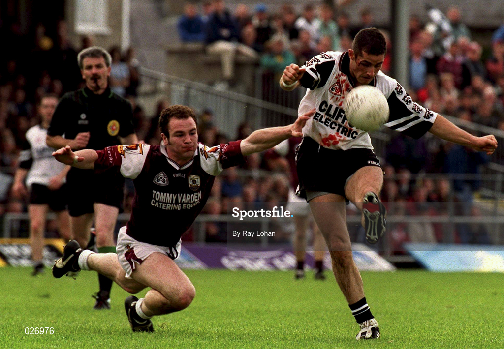 27 June 1999; Eamonn O'Hara, Sligo gets a shot in despite the tackle of John Divilly of Galway during the Bank of Ireland Connacht Senior Football Championship Semi-Final match between Sligo and Galway at Markievicz Park in Sligo. Photo by Ray Lohan/Sportsfile