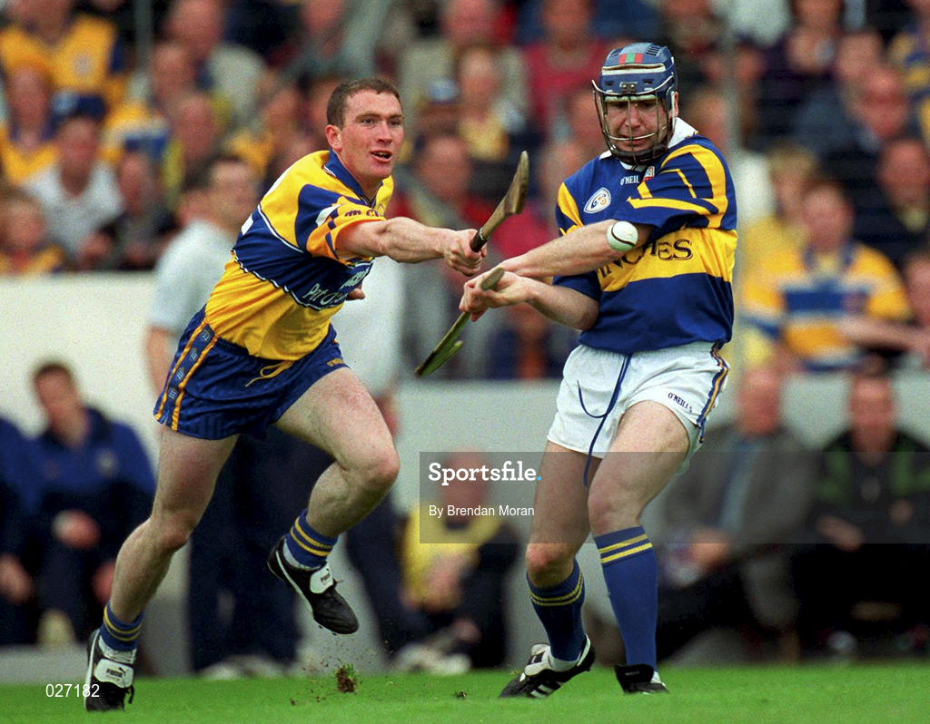 12 June 1999; John Leahy of Tipperary in action against Colin Lynch of Clare during the Munster Senior Hurling Championship Semi final Replay match between Clare v Tipperary at Páirc Uí Chaoimh in Cork. Photo by Brendan Moran/Sportsfile