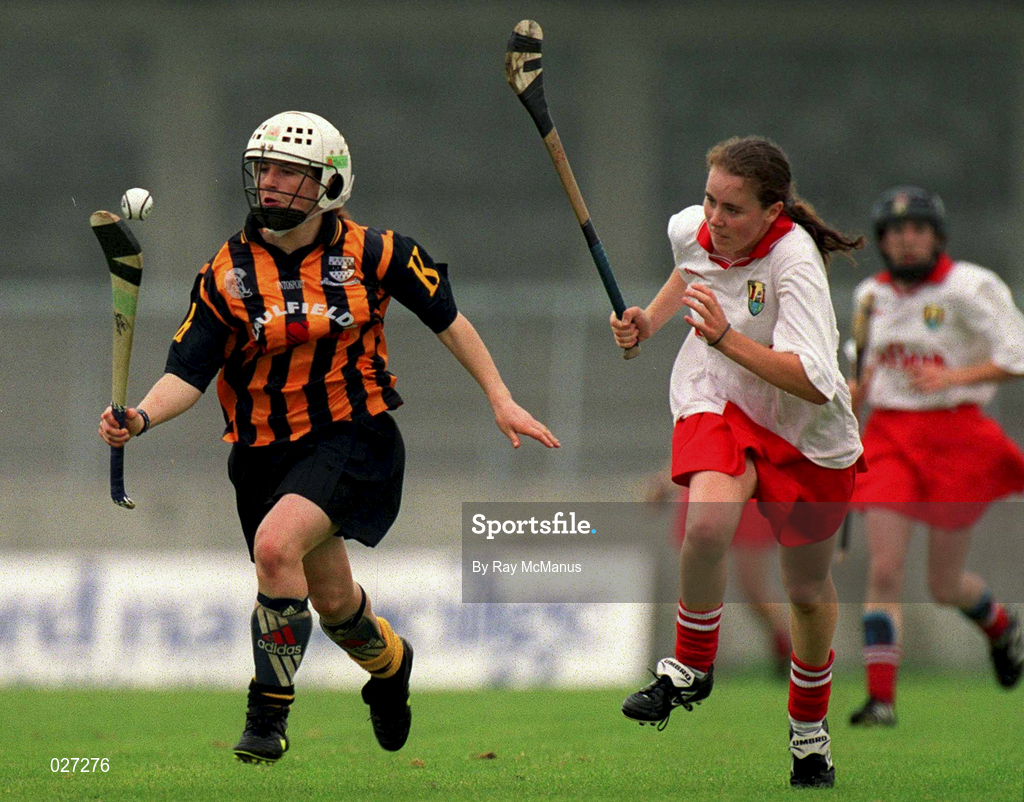 7 August 1999; Lizzie Lyng of Kilkenny in action against Paula O'Connor of Cork during the Bórd na Gaeilge All Ireland Senior Camogie Championship Semi-Final match between Cork and Kilkenny at Parnell Park in Dublin. Photo by Ray McManus/Sportsfile