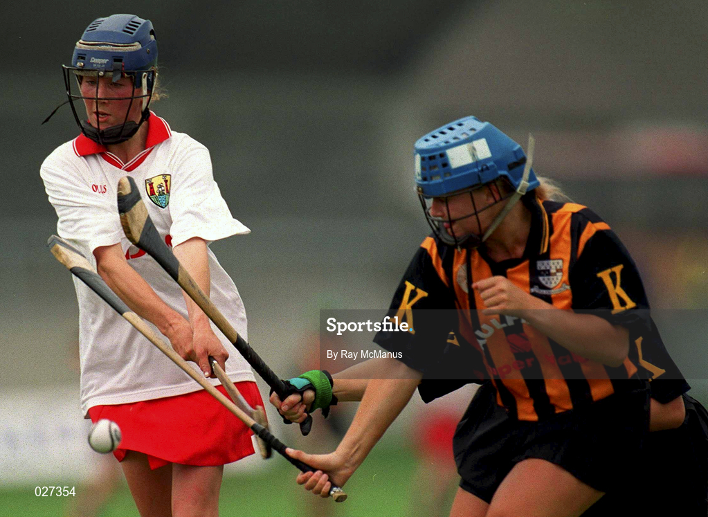 7 August 1999; Sinead O'Callaghan of Cork, has her shot blocked by Kilkenny's Tracey Millea and Margaret Hickey,hidden, during the Bórd na Gaeilge All Ireland Senior Camogie Championship Semi-Final match between Cork and Kilkenny at Parnell Park in Dublin. Photo by Ray McManus/Sportsfile