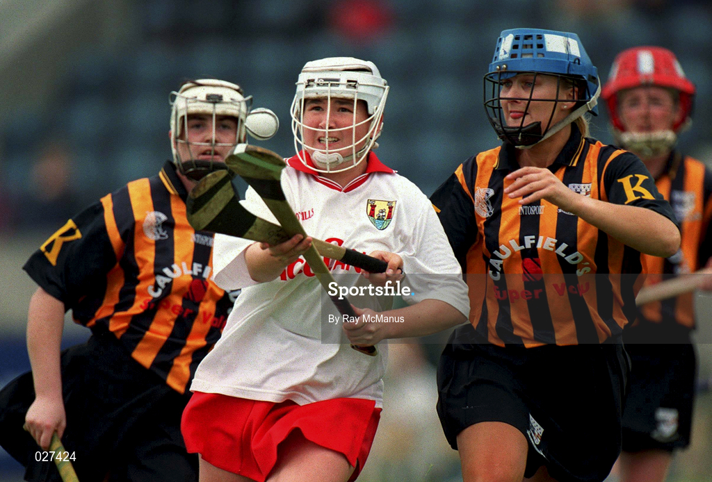 7 August 1999; Miriam Deasy of Cork in action against  Tracey Millea of Kilkenny during the Bórd na Gaeilge All Ireland Senior Camogie Championship Semi-Final match between Cork and Kilkenny at Parnell Park in Dublin. Photo by Ray McManus/Sportsfile