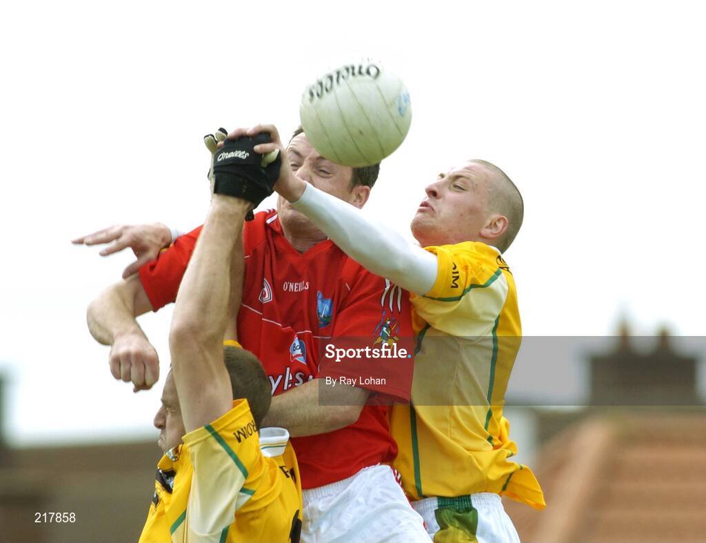 12 August 2006; Martin Farrelly, Louth, in action against Joseph Quinn, left and Kevin McGourty, Antrim. Tommy Murphy Cup, Semi-Final, Louth v Antrim, St. Brigid's Park, Dowdallshill, Dundalk, Co. Louth. Picture credit; Ray Lohan / SPORTSFILE *** Local Caption ***