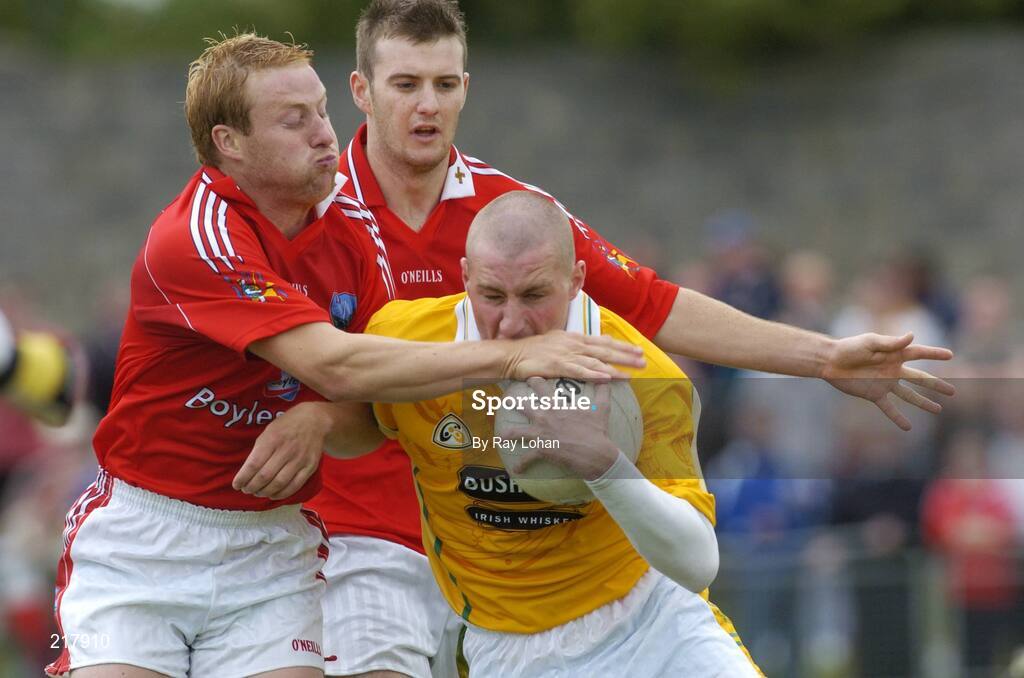 12 August 2006; Kevin McGourty, Antrim, in action against Mick Fannin, left, and Mark Brennan, Antrim. Tommy Murphy Cup, Semi-Final, Louth v Antrim, St. Brigid's Park, Dowdallshill, Dundalk, Co. Louth. Picture credit; Ray Lohan / SPORTSFILE