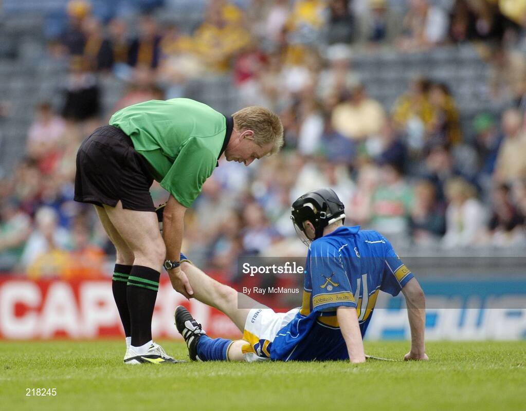 13 August 2006; Clare referee Ger Hoey checks on the welfare of Tipperary's  Thomas McGrath near the end of the game. All-Ireland Minor Hurling Championship, Semi-Final, Kilkenny v Tipperary, Croke Park, Dublin. Picture credit; Ray McManus / SPORTSFILE