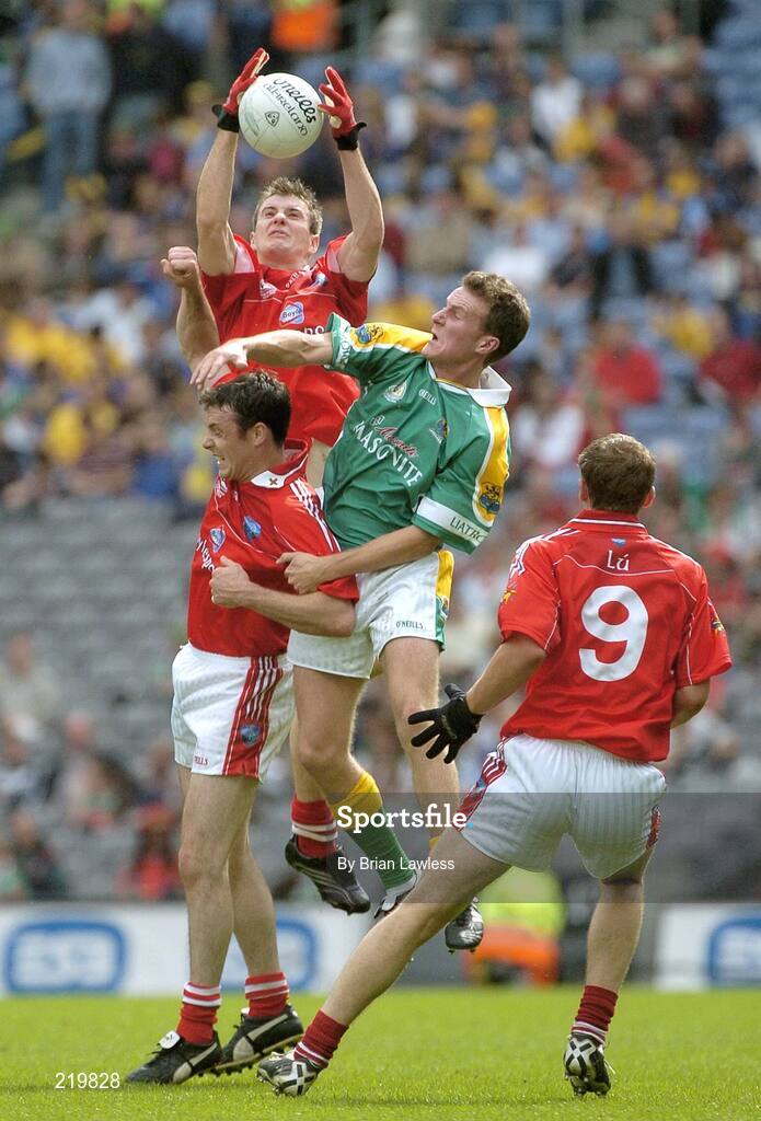 27 August 2006; Mark Brennan, Louth, fields the ball ahead of team-mates Martin Farrelly, Paddy Keenan, 9, and Leitrim's Shane Foley. Tommy Murphy Cup Final, Louth v Leitrim, Croke Park, Dublin. Picture credit; Brian Lawless / SPORTSFILE
