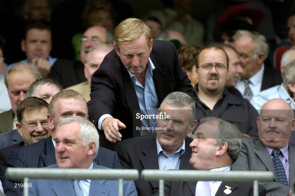 27 August 2006; Leader of the opposition Enda Kenny, T.D., leans forward to wish An Taoiseach Bertie Ahern T.D. well before the start of the game, watched by President of the GAA Nickey Brennan and former President of the GAA Sean McCague. Tommy Murphy Cup Final, Louth v Leitrim, Croke Park, Dublin. Picture credit; Brian Lawless / SPORTSFILE
