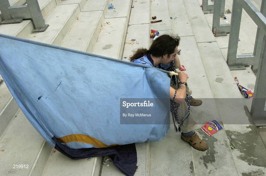 27 August 2006; A distraught Dublin supporter sits on Hill 16 after the game. Bank of Ireland All-Ireland Senior Football Championship Semi-Final, Dublin v Mayo, Croke Park, Dublin. Picture credit; Ray McManus / SPORTSFILE