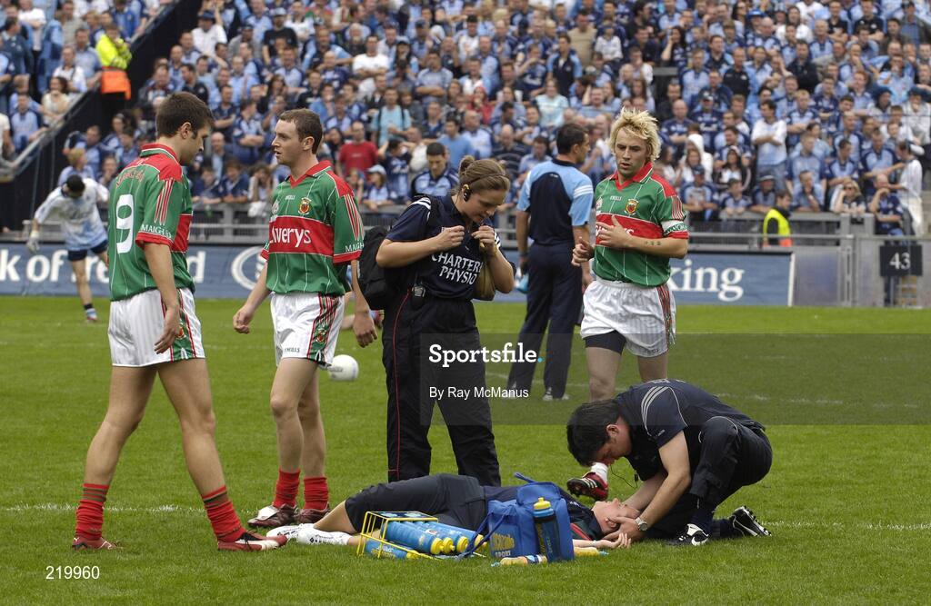 27 August 2006; The Mayo dietician Mary McNicolas is attended to on the pitch during the warm-up before the game. Bank of Ireland All-Ireland Senior Football Championship Semi-Final, Dublin v Mayo, Croke Park, Dublin. Picture credit; Ray McManus / SPORTSFILE