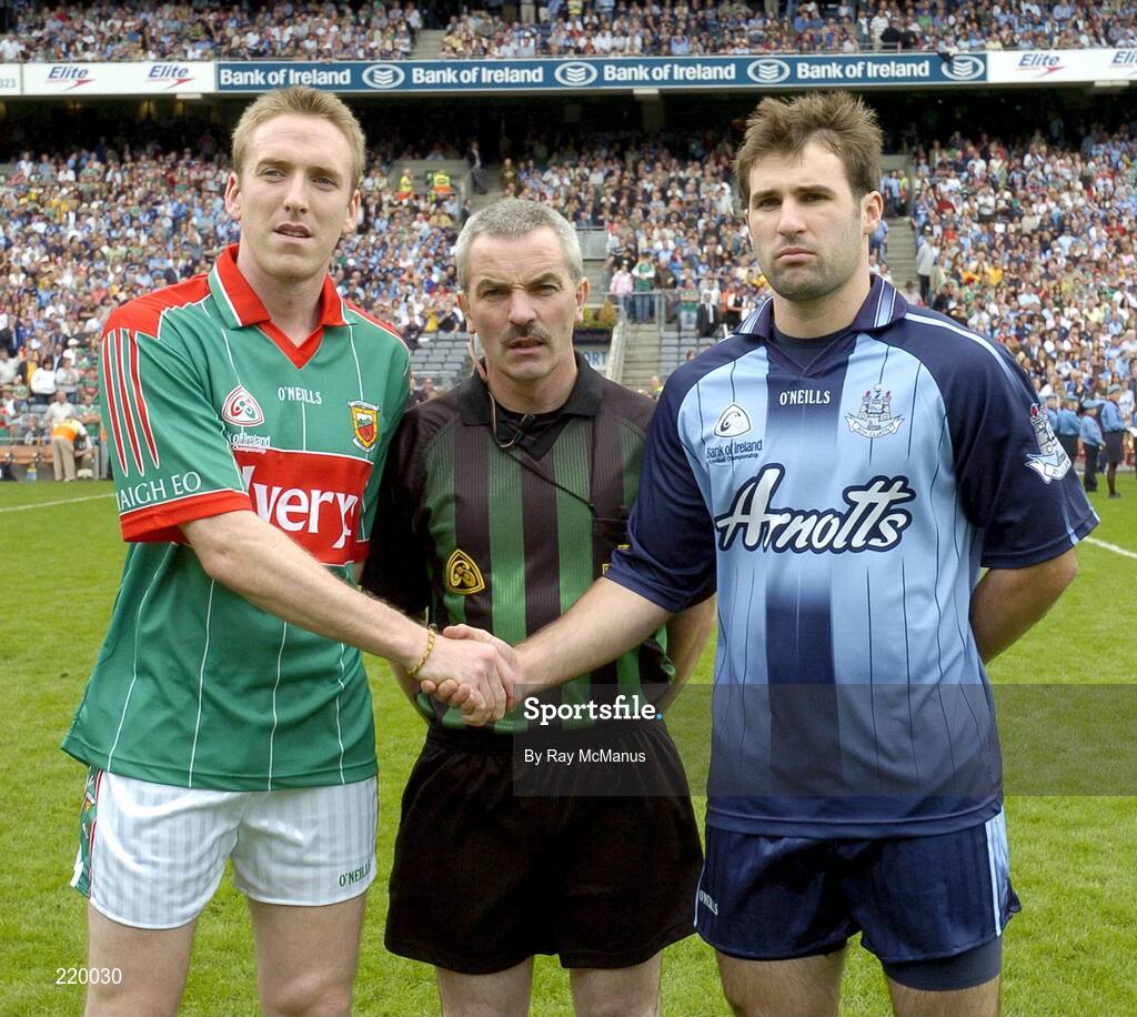 27 August 2006; The two captains, David Heaney, Mayo and Bryan Cullen, Dublin, shake hands accross referee Paddy Russell before the toss. Bank of Ireland All-Ireland Senior Football Championship Semi-Final, Dublin v Mayo, Croke Park, Dublin. Picture credit; Ray McManus / SPORTSFILE