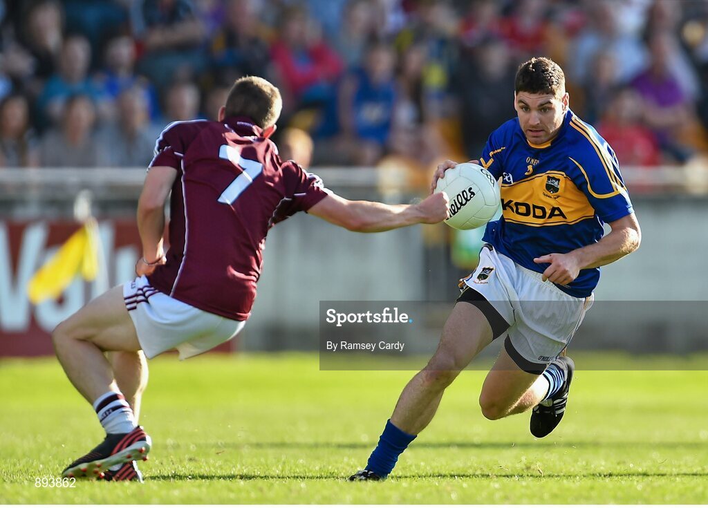 26 July 2014; Philip Austin, Tipperary, in action against Paul Varley, Galway. GAA Football All Ireland Senior Championship, Round 4A, Galway v Tipperary. O'Connor Park, Tullamore, Co. Offaly. Picture credit: Ramsey Cardy / SPORTSFILE