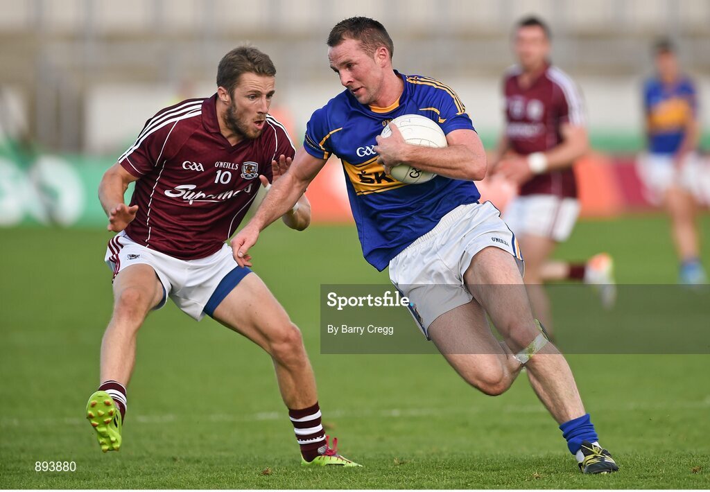26 July 2014; Peter Acheson, Tipperary, in action against Michael Lundy, Galway. GAA Football All Ireland Senior Championship, Round 4A, Galway v Tipperary. O'Connor Park, Tullamore, Co. Offaly. Picture credit: Barry Cregg / SPORTSFILE