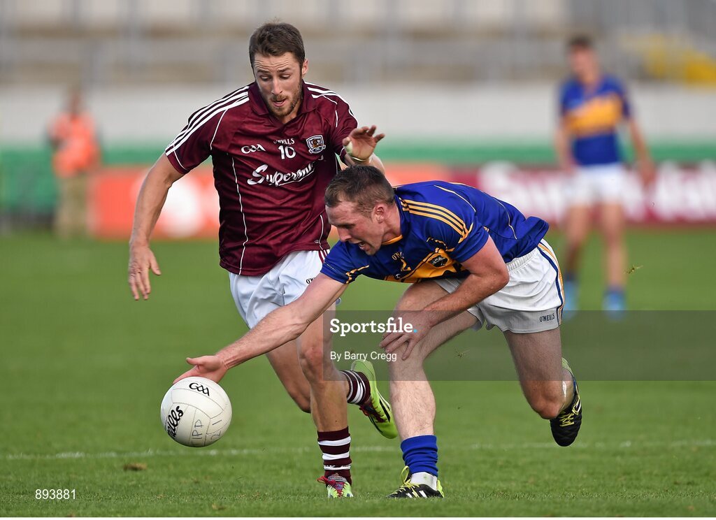 26 July 2014; Peter Acheson, Tipperary, in action against Michael Lundy, Galway. GAA Football All Ireland Senior Championship, Round 4A, Galway v Tipperary. O'Connor Park, Tullamore, Co. Offaly. Picture credit: Barry Cregg / SPORTSFILE