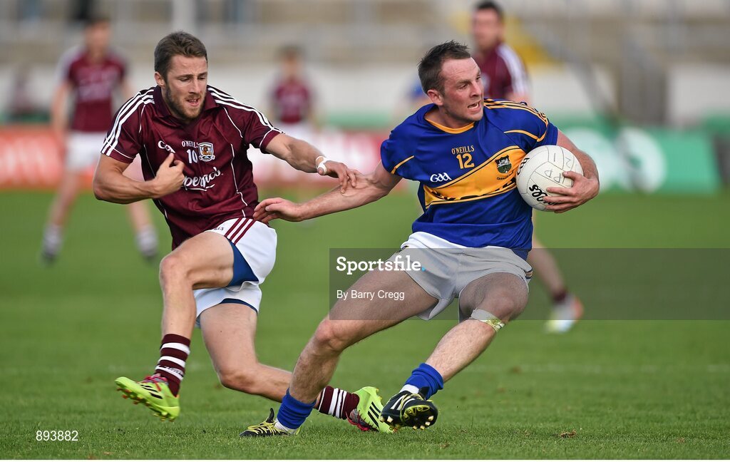 26 July 2014; Peter Acheson, Tipperary, in action against Michael Lundy, Galway. GAA Football All Ireland Senior Championship, Round 4A, Galway v Tipperary. O'Connor Park, Tullamore, Co. Offaly. Picture credit: Barry Cregg / SPORTSFILE