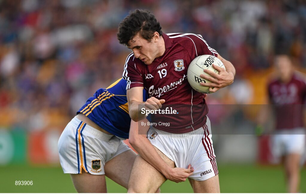 26 July 2014; Daithí Burke, Galway, in action against Conor Sweeney, Tipperary. GAA Football All Ireland Senior Championship, Round 4A, Galway v Tipperary. O'Connor Park, Tullamore, Co. Offaly. Picture credit: Barry Cregg / SPORTSFILE