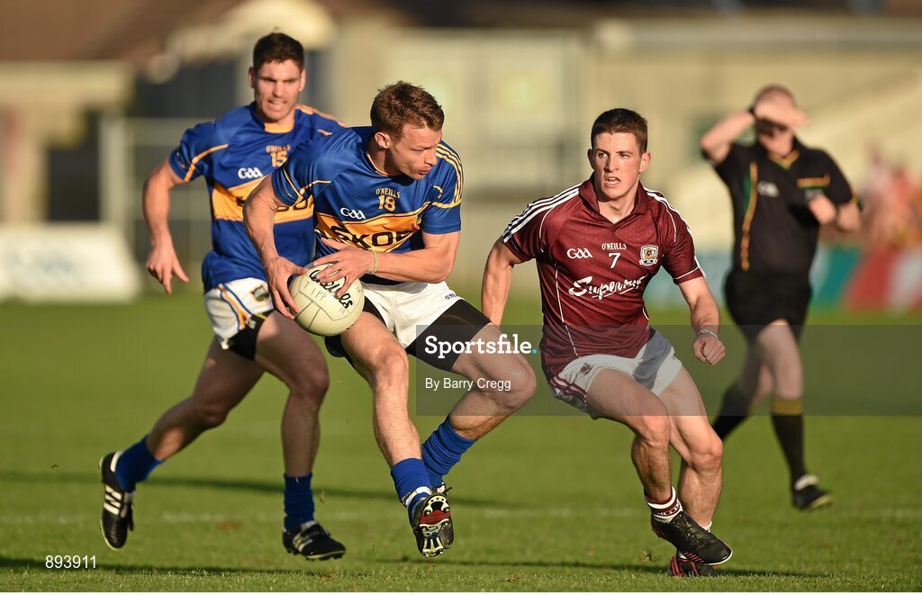 26 July 2014; Hugh Coghlan, Tipperary, with support from team-mate Philip Austin, in action against Paul Varley, Galway. GAA Football All Ireland Senior Championship, Round 4A, Galway v Tipperary. O'Connor Park, Tullamore, Co. Offaly. Picture credit: Barry Cregg / SPORTSFILE