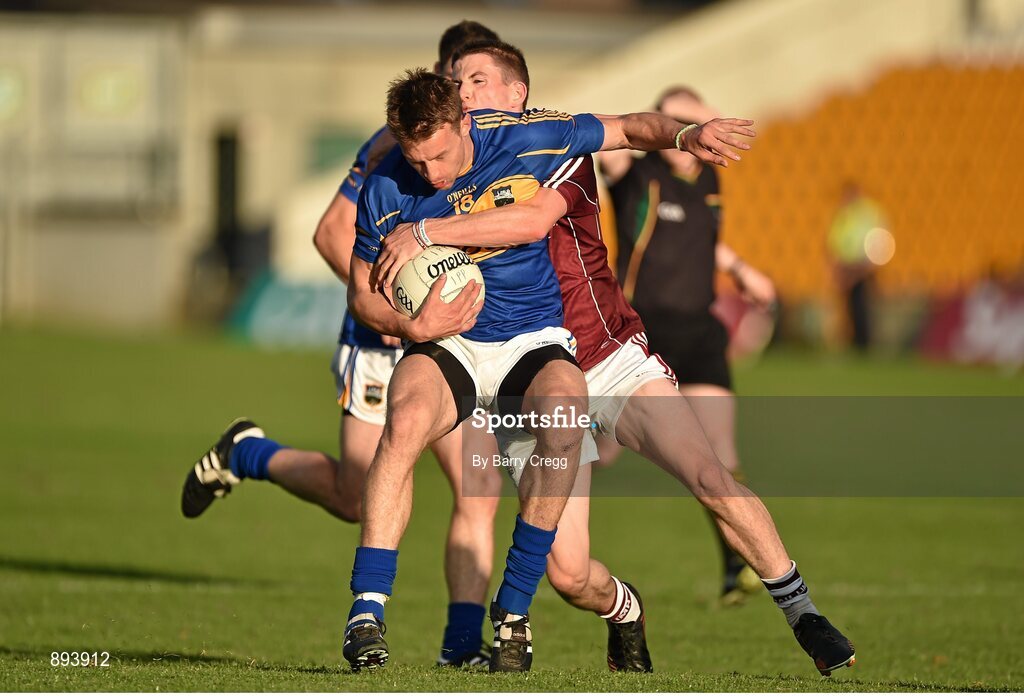 26 July 2014; Hugh Coghlan, Tipperary, with support from team-mate Philip Austin, in action against Paul Varley, Galway. GAA Football All Ireland Senior Championship, Round 4A, Galway v Tipperary. O'Connor Park, Tullamore, Co. Offaly. Picture credit: Barry Cregg / SPORTSFILE