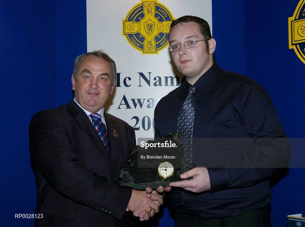 15 July 2006; Gerald McCloughan, from Tyrone, receives his GAA MacNamee award for "Best Website" from GAA President Nickey Brennan at the 2006 GAA MacNamee awards. Burlington Hotel, Dublin. Picture credit: Brendan Moran / SPORTSFILE