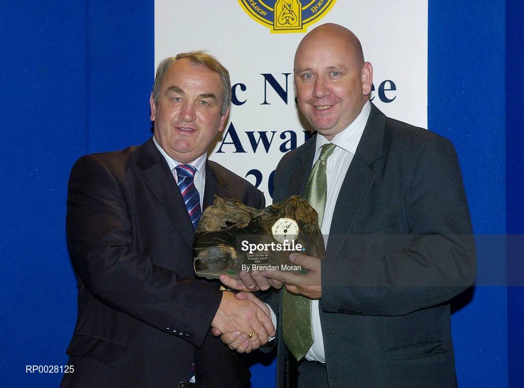 15 July 2006; Mike McCartney, originally from Loughrea, Co. Galway but now working for Clare FM, receives his GAA MacNamee award on behalf of Clare FM for "Best Local Radio Programme" from GAA President Nickey Brennan at the 2006 GAA MacNamee awards. Burlington Hotel, Dublin. Picture credit: Brendan Moran / SPORTSFILE
