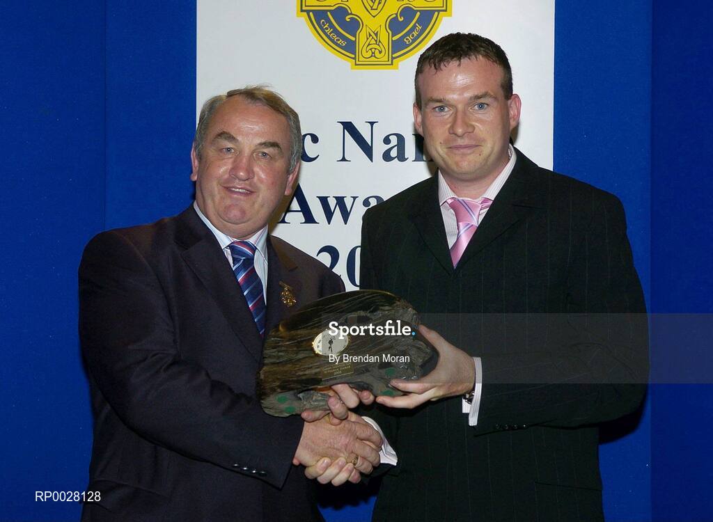 15 July 2006; Damian Lawlor, from Tipperary, and of the Sunday Independent receives his GAA MacNamee award for "Best Article in a National or Provincial Newspaper" from GAA President Nickey Brennan at the 2006 GAA MacNamee awards. Burlington Hotel, Dublin. Picture credit: Brendan Moran / SPORTSFILE