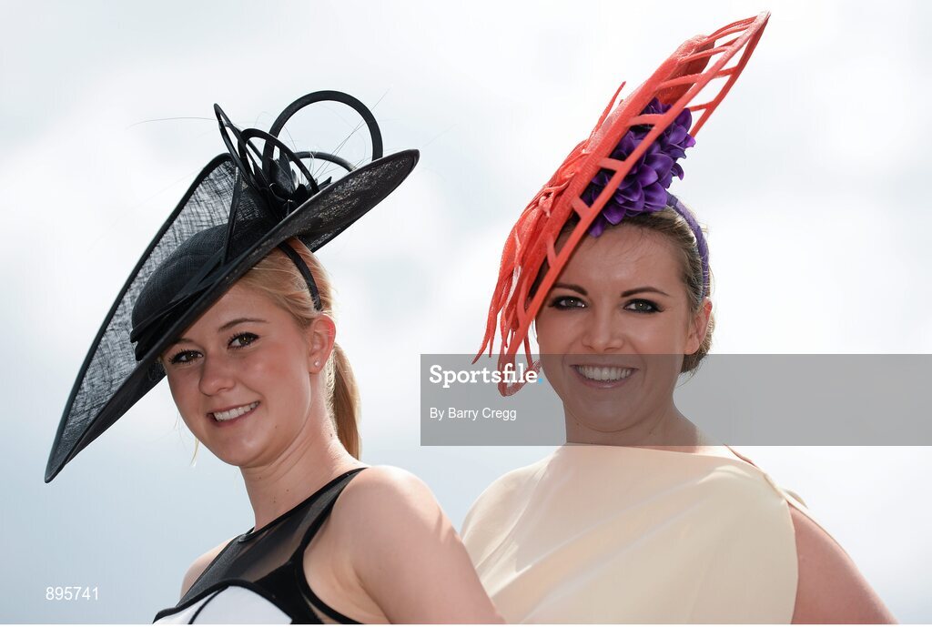 31 July 2014; Carolin Hilker, left, from Bielefeld, Germany, and Laura Gibson, from Mullingar, Co. Westmeath, enjoying a day at the races. Galway Racing Festival, Ballybrit, Co. Galway. Picture credit: Barry Cregg / SPORTSFILE