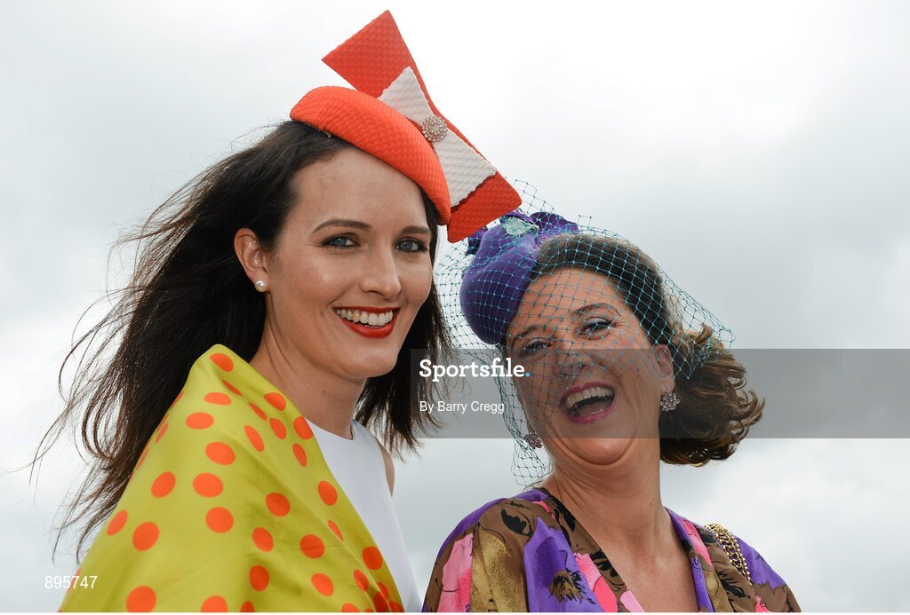 31 July 2014; Ciara Silke, left, from Bushypark, Co. Galway, and Sarah McGahon, from Bray, Co. Wicklow, enjoying a day at the races. Galway Racing Festival, Ballybrit, Co. Galway. Picture credit: Barry Cregg / SPORTSFILE