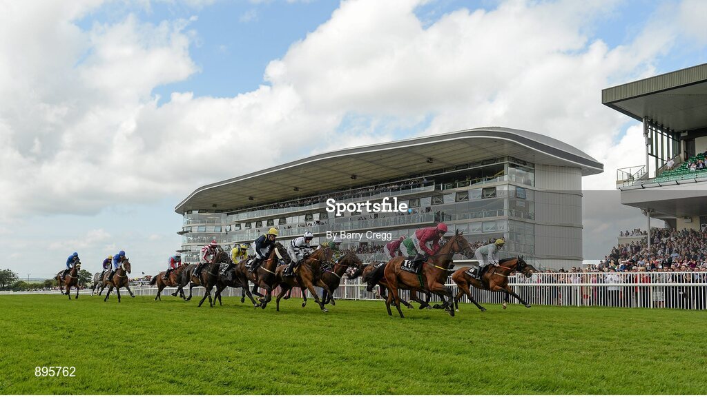 31 July 2014; A general view of the field passing the stand after the start of the GuinnessPlus App Beginners Steeplechase. Galway Racing Festival, Ballybrit, Co. Galway. Picture credit: Barry Cregg / SPORTSFILE