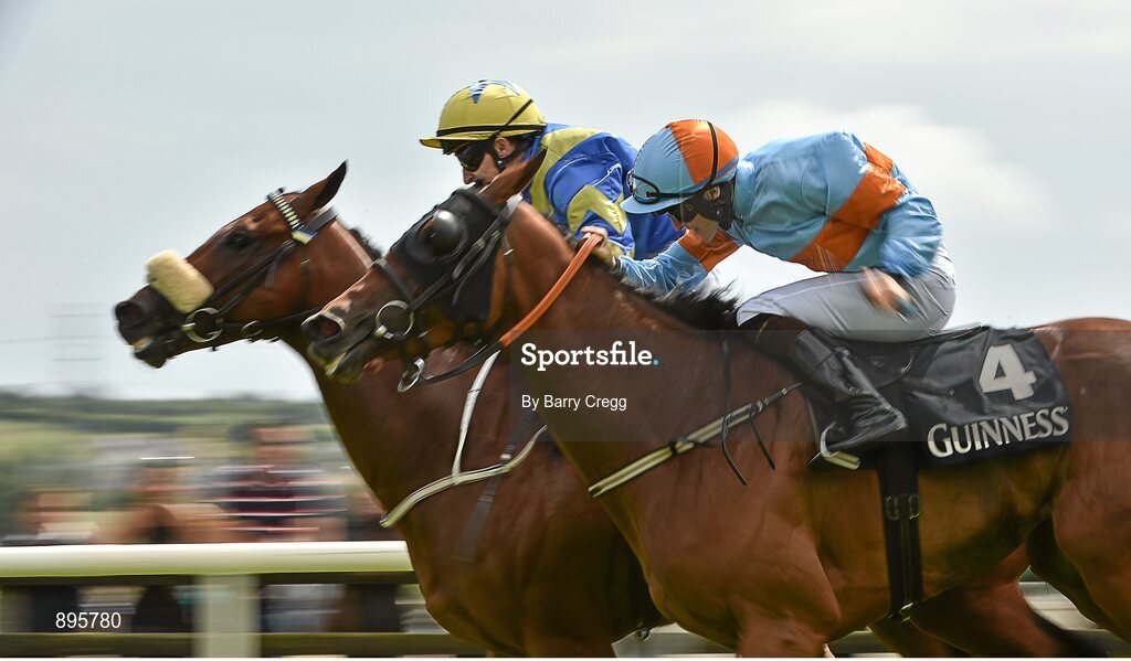 31 July 2014; Hasanour, left, with Shane Foley up, beats Sretaw, with Gary Halpin up, by a head to win the Guinness Time Handicap. Galway Racing Festival, Ballybrit, Co. Galway. Picture credit: Barry Cregg / SPORTSFILE