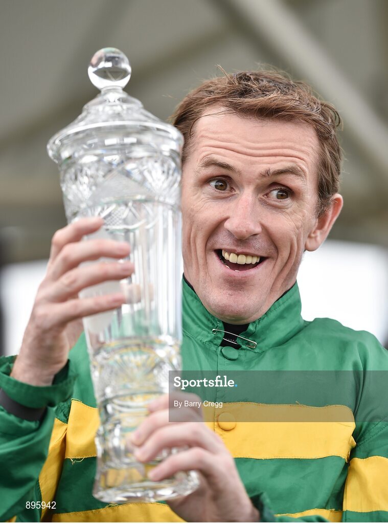 31 July 2014; Jockey Tony McCoy holds up the winning trophy after rode Thomas Edison to victory in the Guinness Galway Hurdle Handicap. Galway Racing Festival, Ballybrit, Co. Galway. Picture credit: Barry Cregg / SPORTSFILE