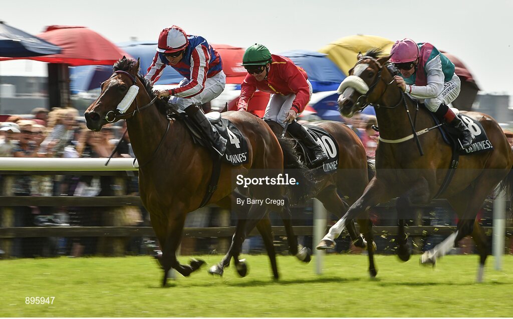 31 July 2014; Dalkova, left, with Niall McCullagh up, comes to the finish ahead of Tested, right, with Pat Smullen up, who finished second, and Colour Blue, centre, with Gary Carroll up, who finished third, on their way to winning the Arthur Guinness European Breeders Fund Corrib Fillies Stakes. Galway Racing Festival, Ballybrit, Co. Galway. Picture credit: Barry Cregg / SPORTSFILE