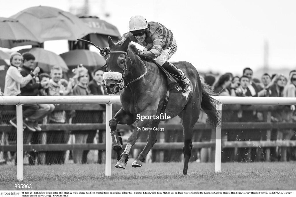 31 July 2014; (Editors please note; This black & white image has been created from an original colour file) Thomas Edison, with Tony McCoy up, on their way to winning the Guinness Galway Hurdle Handicap. Galway Racing Festival, Ballybrit, Co. Galway. Picture credit: Barry Cregg / SPORTSFILE