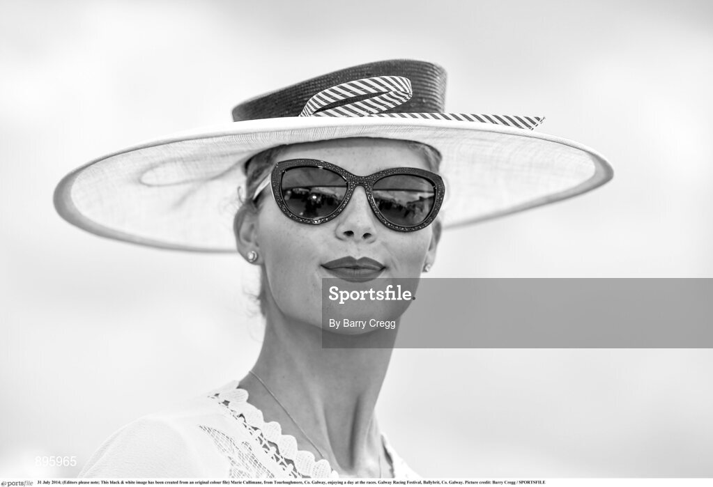31 July 2014; (Editors please note; This black & white image has been created from an original colour file) Marie Cullimane, from Tourloughmore, Co. Galway, enjoying a day at the races. Galway Racing Festival, Ballybrit, Co. Galway. Picture credit: Barry Cregg / SPORTSFILE
