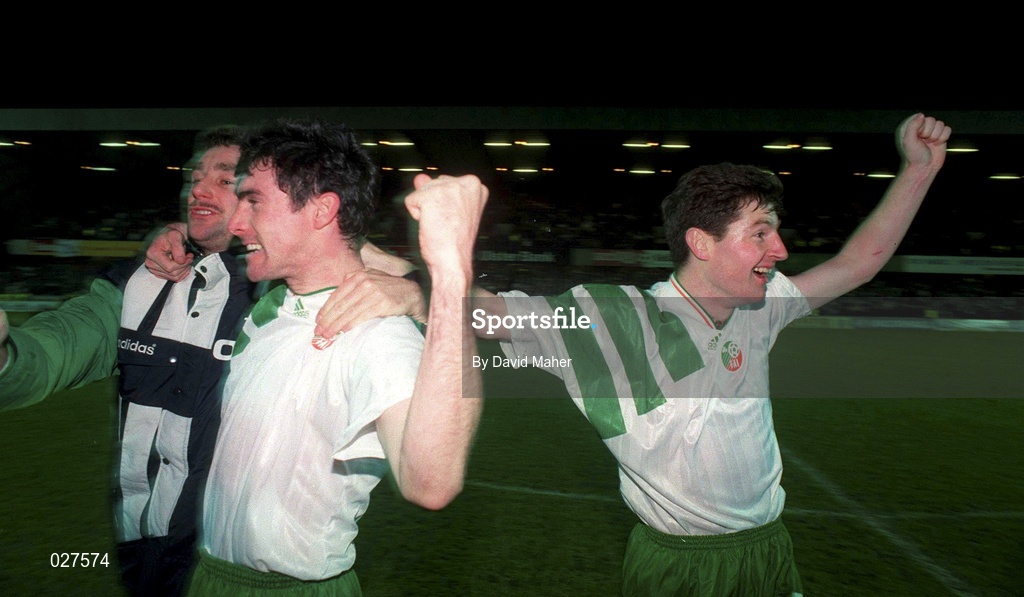 17 November 1993; Republic of Ireland players, from left, John Aldridge, Alan McLoughlin and Denis Irwin celebrate their qualification for the 1994 FIFA World Cup following the FIFA World Cup Qualifying Group 3 match between Northern Ireland and Republic of Ireland at Windsor Park in Belfast. Photo by David Maher/Sportsfile