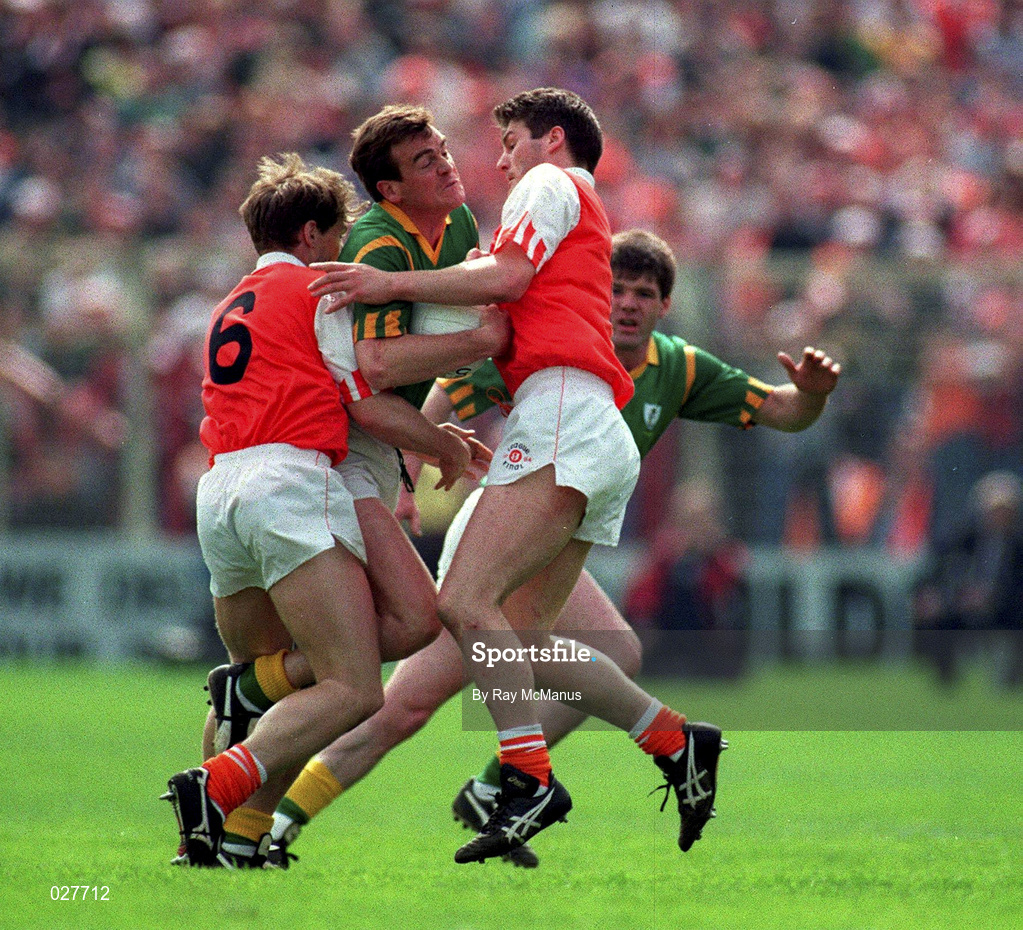 1 May 1994; Colm O'Rourke of Meath is tackled by Kieran McGeeney, 6, and Jarlath Burns, right, of Armagh during the Church & General National Football League Final between Armagh and Meath at Croke Park in Dublin. Photo by Ray McManus/Sportsfile