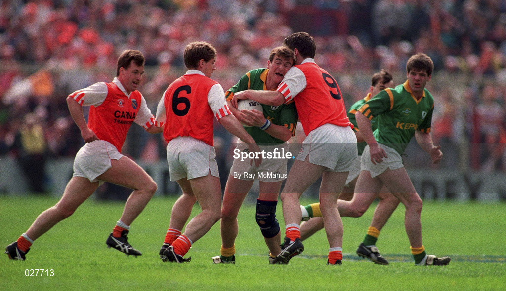 1 May 1994; Colm O'Rourke of Meath is tackled by Kieran McGeeney, 6, and Jarlath Burns, 9, of Armagh during the Church & General National Football League Final between Armagh and Meath at Croke Park in Dublin. Photo by Ray McManus/Sportsfile