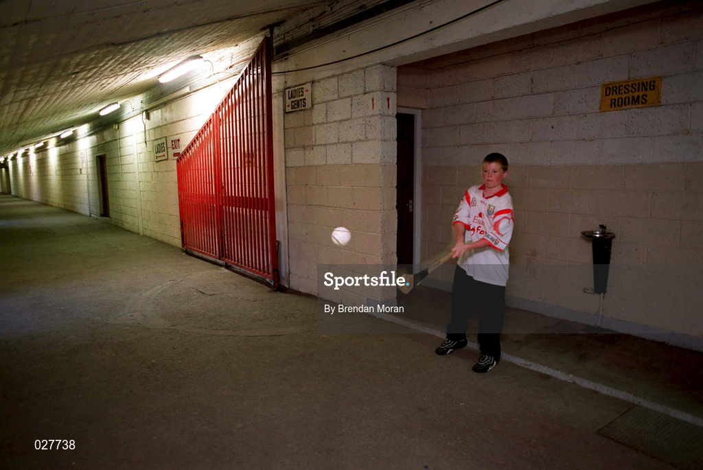 30 August 1999; A young Cork fan practises during a training session, at Páirc Uí Chaoimh in Cork, in advance of the Guinness All-Ireland Senior Hurling Championship Final. Photo by Brendan Moran/Sportsfile