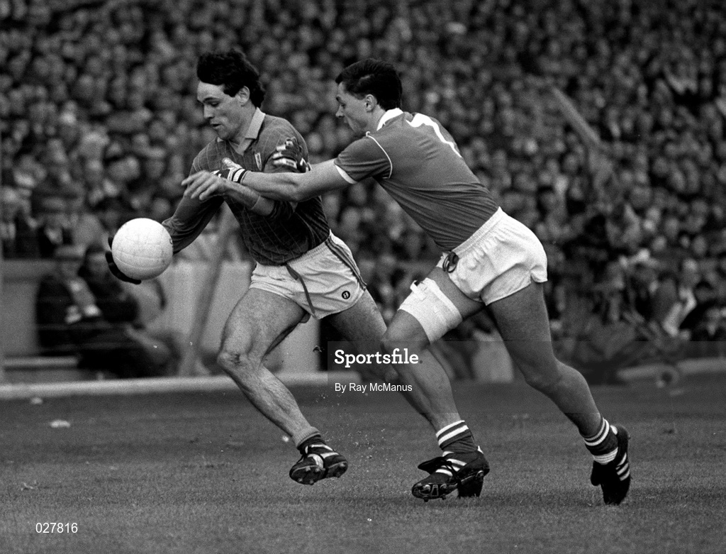 15 April 1990; David Beggy of Meath is tackled by Tony Davis of Cork during the Royal Liver Assurance National Football League Semi-Final match between Meath and Cork at Croke Park in Dublin. Photo by Ray McManus/Sportsfile