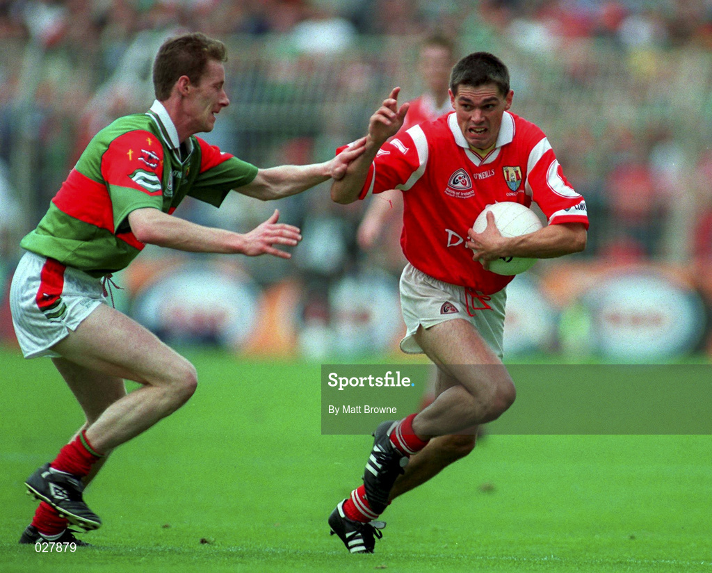 22 August 1999; Don Davis of Cork is tackled by James Nallen of Mayo during the Bank of Ireland All-Ireland Senior Football Championship Semi-Final match between Cork and Mayo at Croke Park in Dublin. Photo by Matt Browne/Sportsfile
