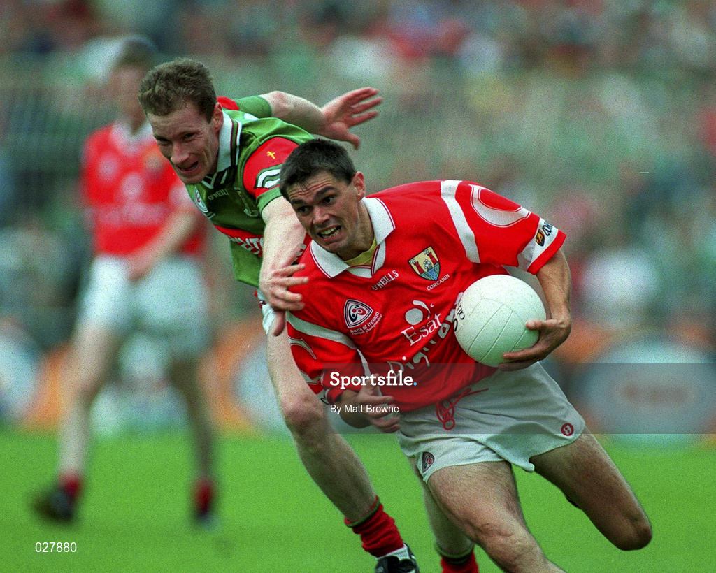 22 August 1999; Don Davis of Cork is tackled by James Nallen of Mayo during the Bank of Ireland All-Ireland Senior Football Championship Semi-Final match between Cork and Mayo at Croke Park in Dublin. Photo by Matt Browne/Sportsfile