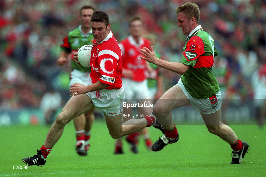 22 August 1999; Joe Kavanagh of Cork in action against David Heaney of Mayo during the Bank of Ireland All-Ireland Senior Football Championship Semi-Final match between Cork and Mayo at Croke Park in Dublin. Photo by Ray McManus/Sportsfile