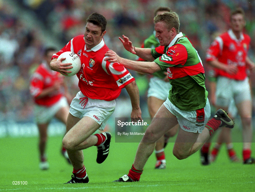 22 August 1999; Joe Kavanagh of Cork in action against David Heaney of Mayo during the Bank of Ireland All-Ireland Senior Football Championship Semi-Final match between Cork and Mayo at Croke Park in Dublin. Photo by Ray McManus/Sportsfile