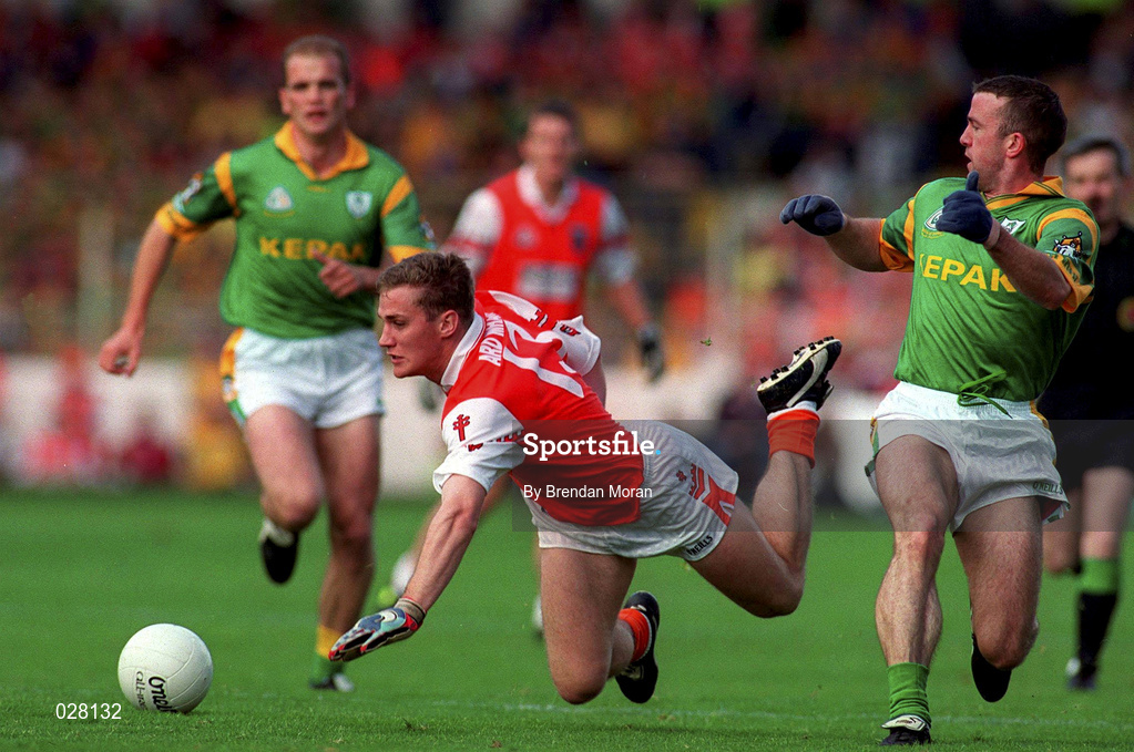 29 August 1999; John McEntee of Armagh is tackled by Evan Kelly of Meath during the Bank of Ireland All-Ireland Senior Football Championship Semi-Final match between Meath and Armagh at Croke Park in Dublin. Photo by Brendan Moran/Sportsfile