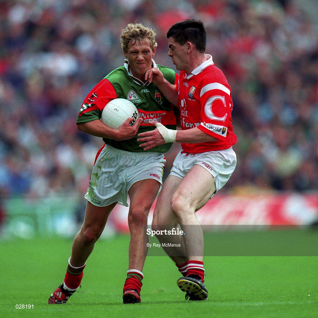 22 August 1999; Ciaran McDonald of Mayo in action against Michael Cronin of Cork during the Bank of Ireland All-Ireland Senior Football Championship Semi-Final match between Cork and Mayo at Croke Park in Dublin. Photo by Ray McManus/Sportsfile