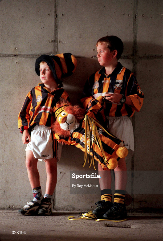 1 September 1999; Kilkenny supporters Fergal Brennan, age 6, and his brother Conor, age 8, from O'Loughlin Gaels Club, watch on during a Kilkenny training session, at Nowlan Park, Kilkenny, in advance of the Guinness All-Ireland Senior Hurling Championship Final. Photo by Ray McManus/Sportsfile