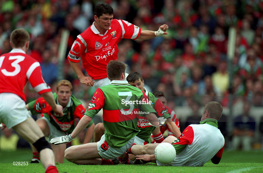22 August 1999; Mark O'Sullivan of Cork has his shot blocked by the Mayo defence in the build-up to Philip Clifford, 13, scoring their first goal during the Bank of Ireland All-Ireland Senior Football Championship Semi-Final match between Cork and Mayo at Croke Park in Dublin. Photo by Ray McManus/Sportsfile