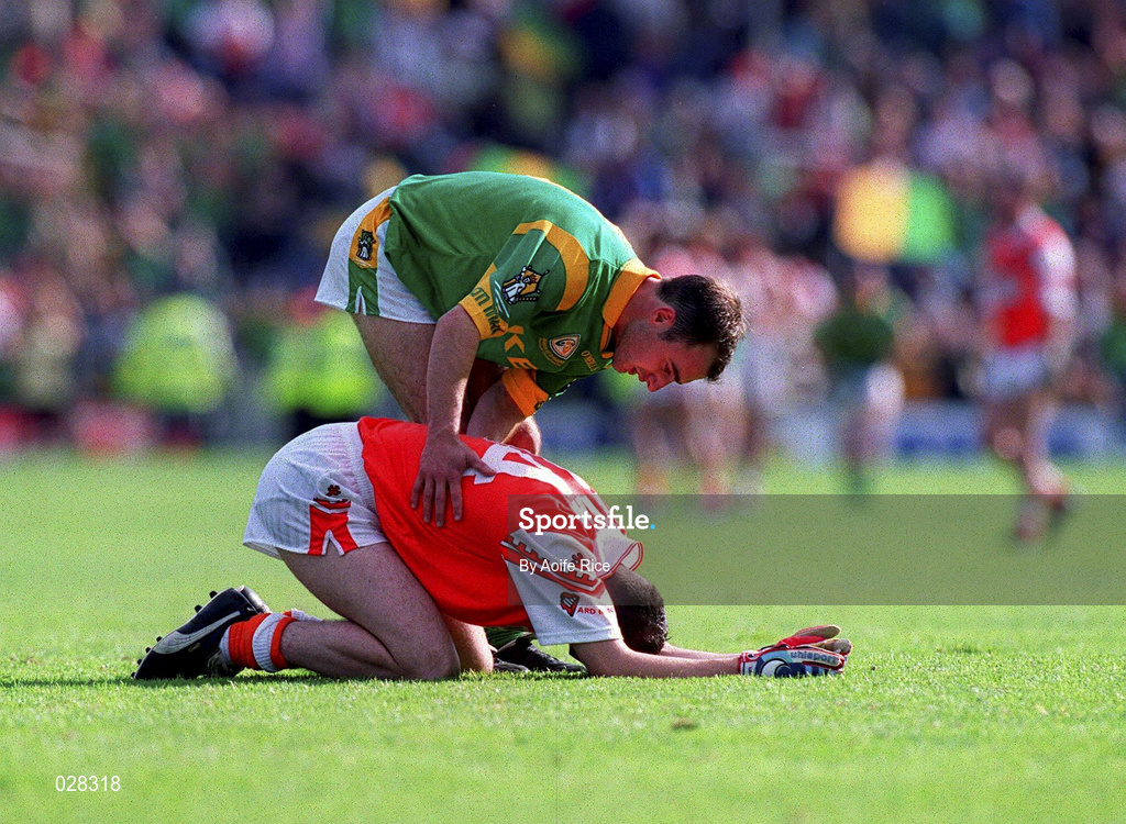 29 August 1999; Meath's Paddy Reynolds consoles Oisin McConville following the Bank of Ireland All-Ireland Senior Football Championship Semi-Final match between Meath and Armagh at Croke Park in Dublin. Photo by Aoife Rice/Sportsfile