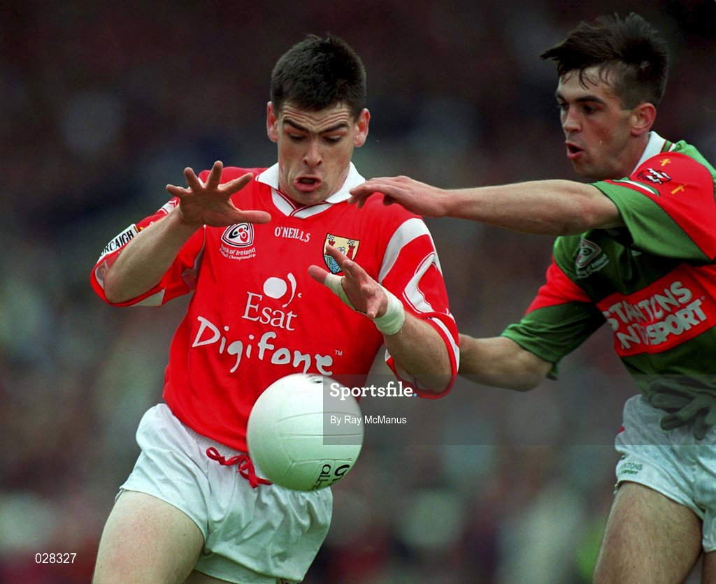 22 August 1999; Michael Cronin of Cork is tackled by Alan Roche of Mayo during the Bank of Ireland All-Ireland Senior Football Championship Semi-Final match between Cork and Mayo at Croke Park in Dublin. Photo by Ray McManus/Sportsfile