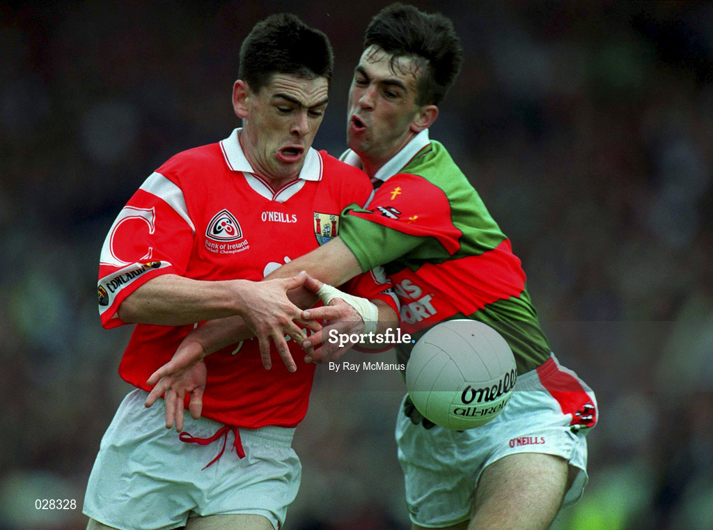 22 August 1999; Michael Cronin of Cork is tackled by Alan Roche of Mayo during the Bank of Ireland All-Ireland Senior Football Championship Semi-Final match between Cork and Mayo at Croke Park in Dublin. Photo by Ray McManus/Sportsfile