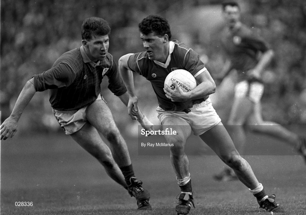 15 April 1990; Michael McCarthy of Cork in action against Robbie O'Malley of Meath during the Royal Liver Assurance National Football League Semi-Final match between Meath and Cork at Croke Park in Dublin. Photo by Ray McManus/Sportsfile